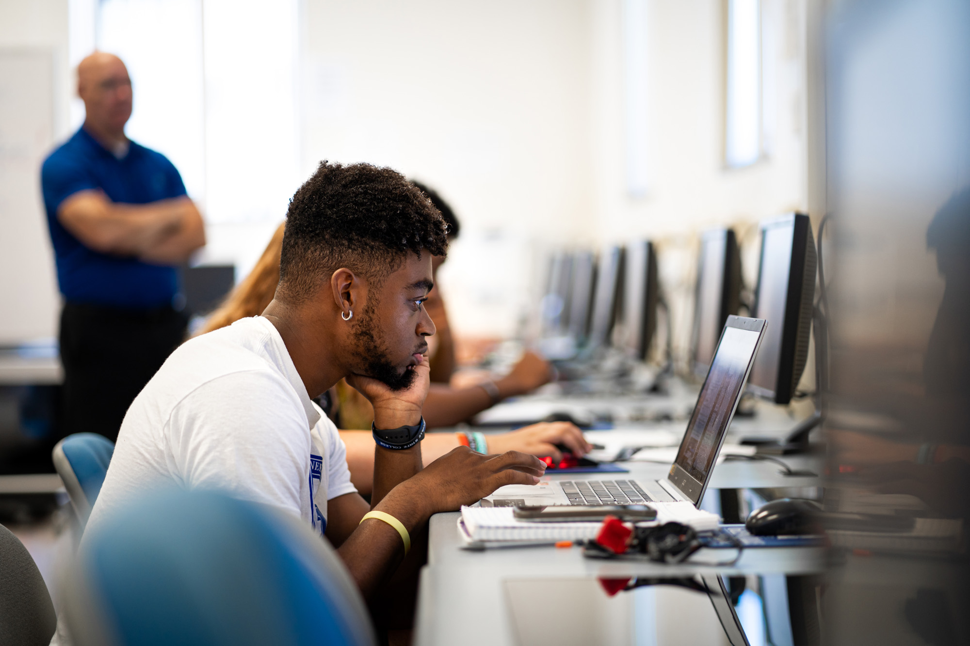 Students sitting in computer lab.