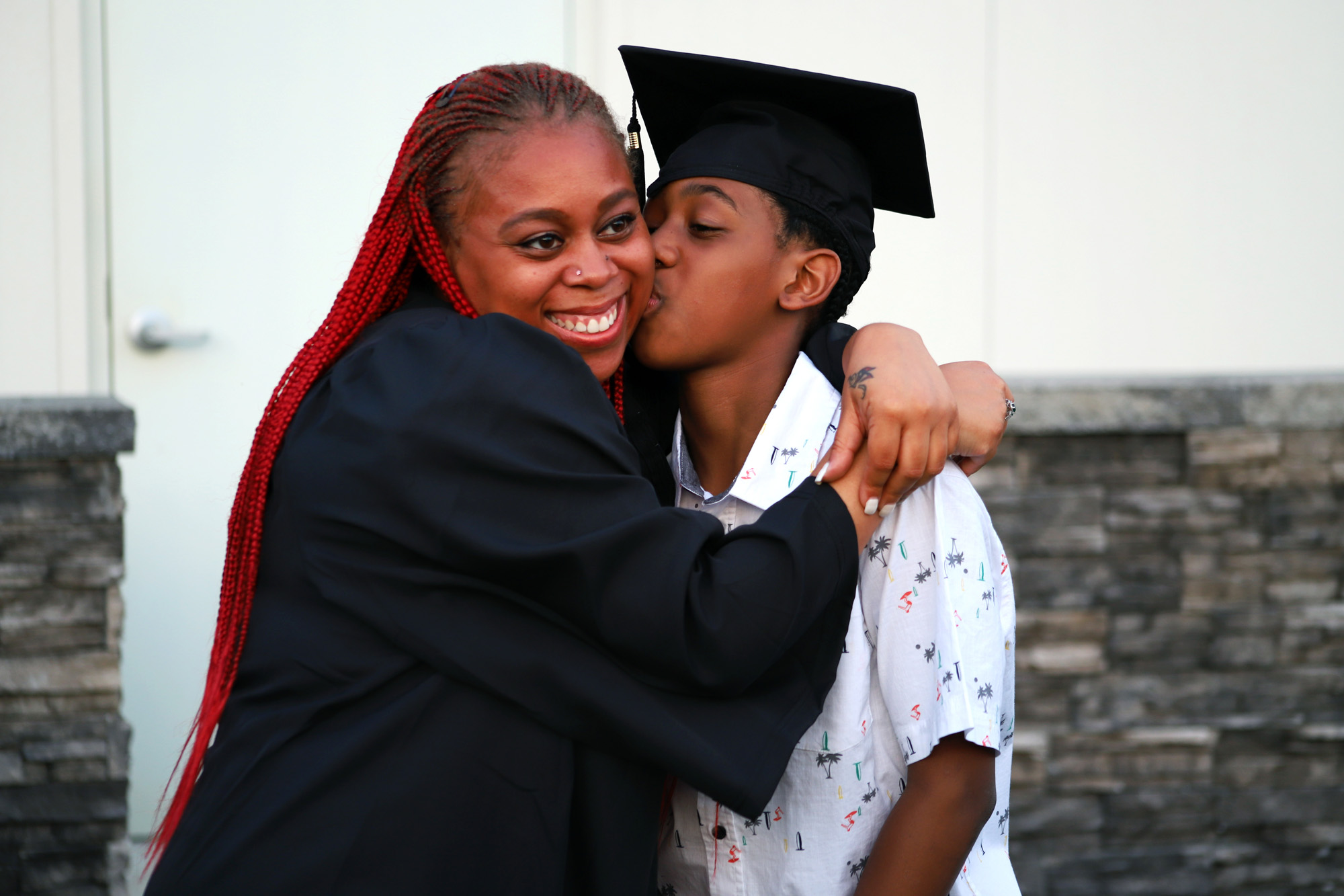 Mom hugging kid.